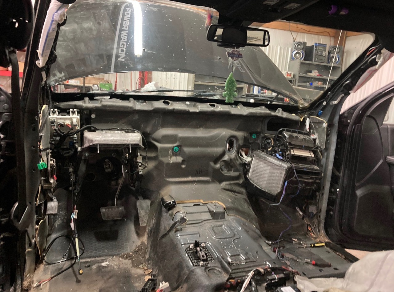Interior teardown during vehicle repair at Plumb Easy