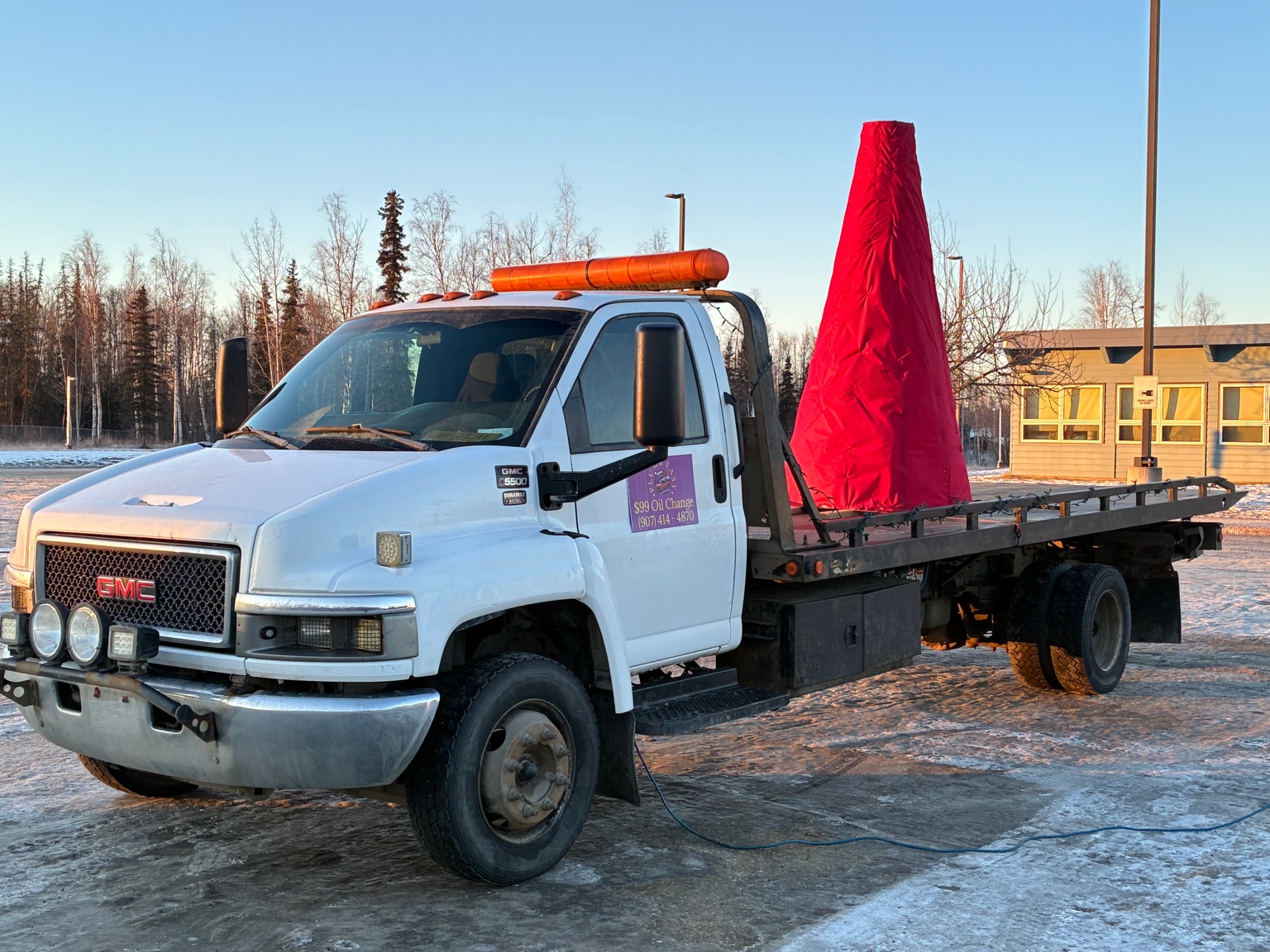Flatbed transport with secured oversized item